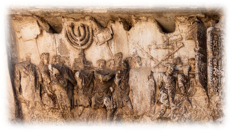 The stone relief inside the Arch of Titus showing Roman soldiers carrying a large seven-branched lampstand on poles